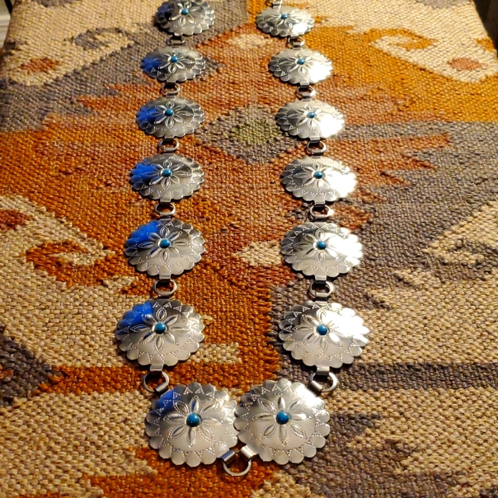 Southwestern style belt. Silver color, faux turquoise accents.